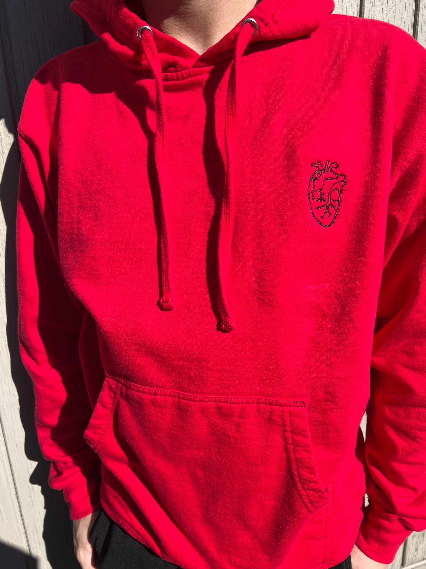 Human heart outline red hoodie